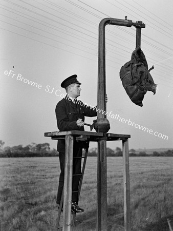 DANGLING MAILBAG WITH WORKER